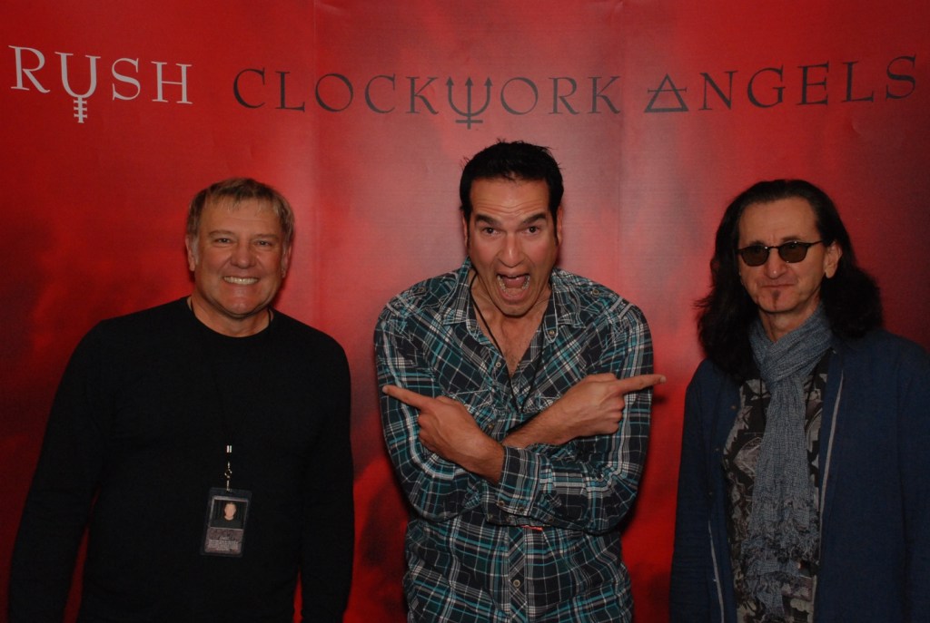 Left to right: Alex Lifeson, Matt Beeson, Geddy Lee. 